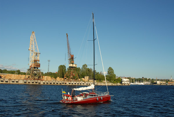 Swedish sailboat sailing up the Daugava River towards Riga