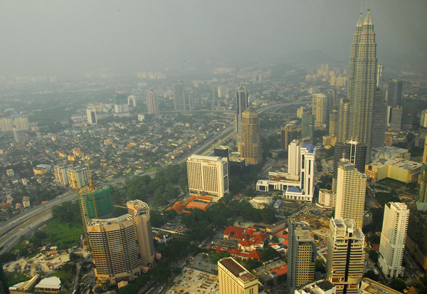 View east from Menara Kuala Lumpur, KL Tower, with Petronas Towers, Kuala Lumpur
