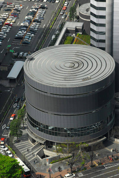 Low cylindrical building next to Shinjuku I-Land Tower