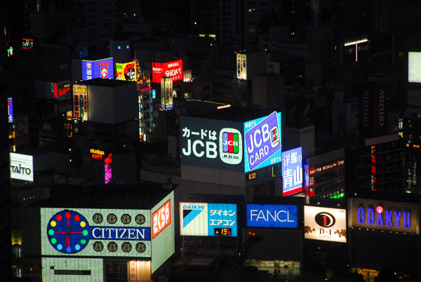 Nishi-shinjuku 1 advertising lit up at night