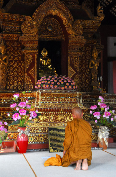 Monk praying in the Ordination Hall