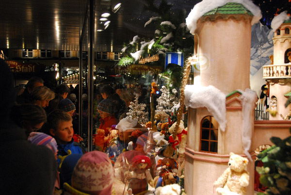 Kids checking out a department store window decorated for Christmas, Neuhauser Strasse, Munich