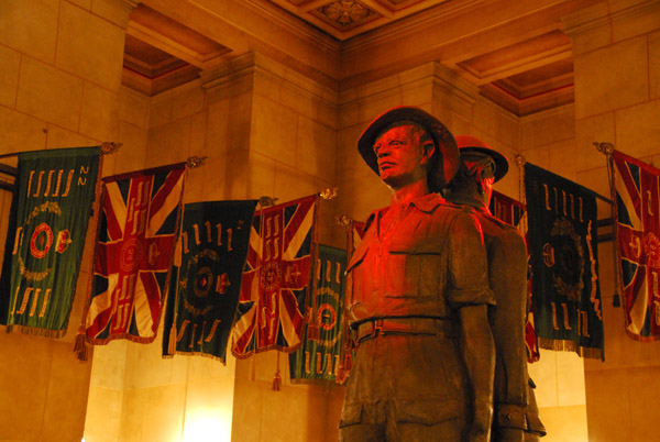 Regimental Colours with the statue of Father and Son, Shrine of Remembrance