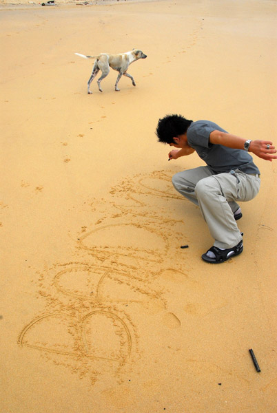 Jeng writing in the sand