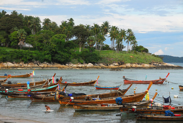 Local fishing fleet (long-tail boats) at the east end of Rawai Beach