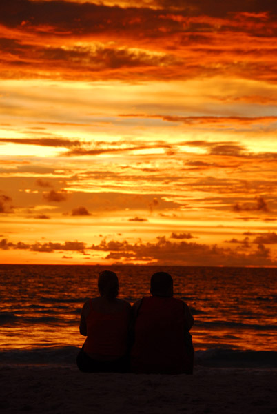 Couple on the beach at sunset, Patong