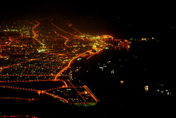 Dubai coast at night seen from over Sharjah