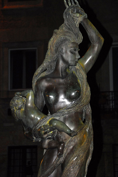 Sculpture of a long haired woman and baby