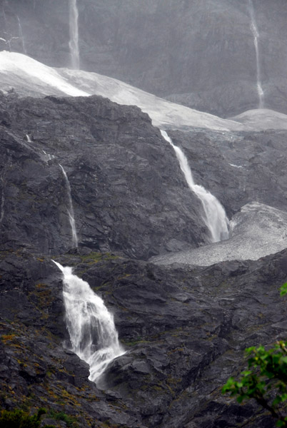 Dozens of waterfalls run off from the glacier