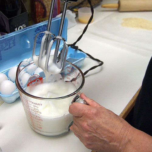 Beat 3 egg whites until they peak