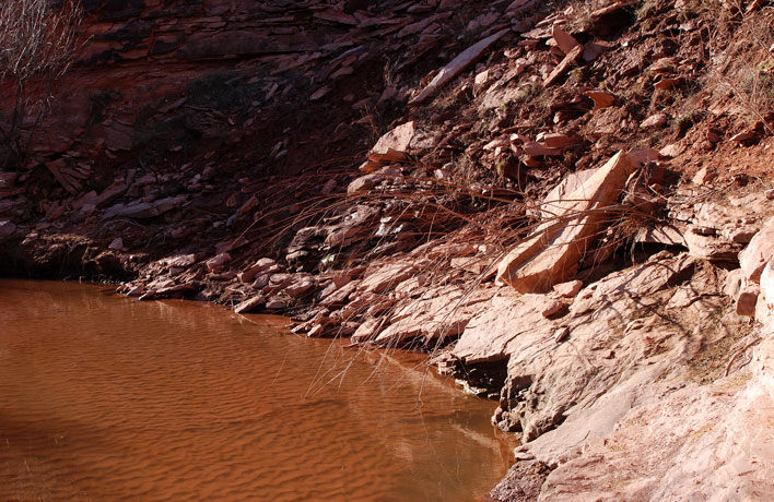 Trail has been damaged by slumping on the right