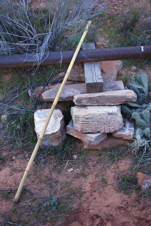 This is one way to install a pipeline in the desert (bamboo stick is 6 feet [1.8m] long)