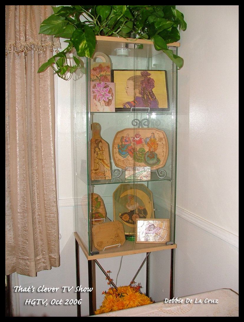 my 2nd display case with my woodburning plaques and boxes.