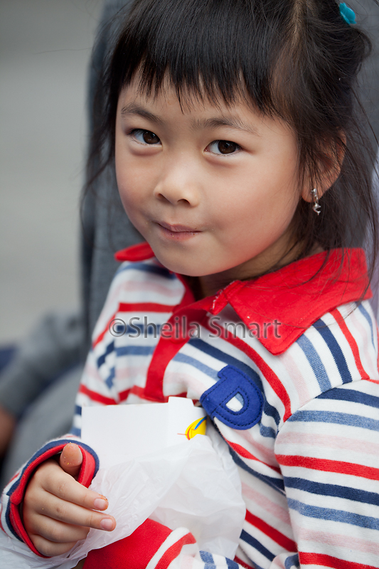 Little girl posing at festival