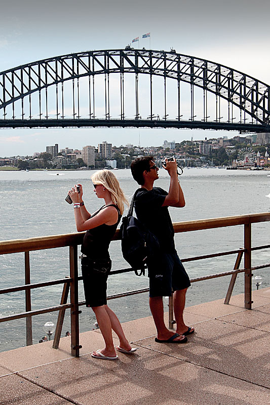 You capture the bridge, darling, while I shoot the Opera house!