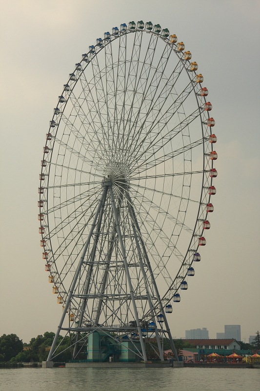 Huge ferris wheel at Li Park, Wuxi, photographed from on Taihu Lake
