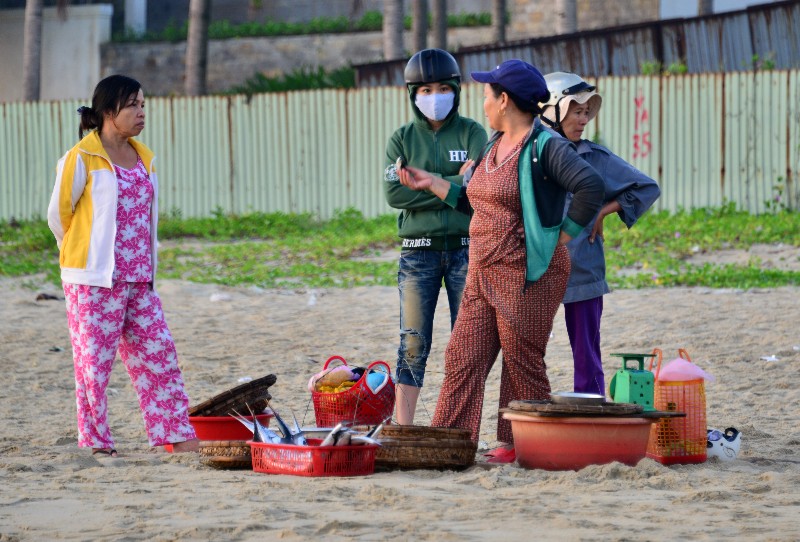 selling fish on the beach, Sao Bien public beach, Danang, Vietnam 