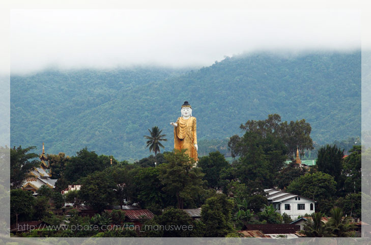 View wat jomsak pointing Buddha from wat that jom kham