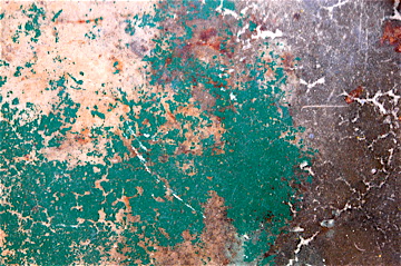 Concrete floor with several layers of paint.