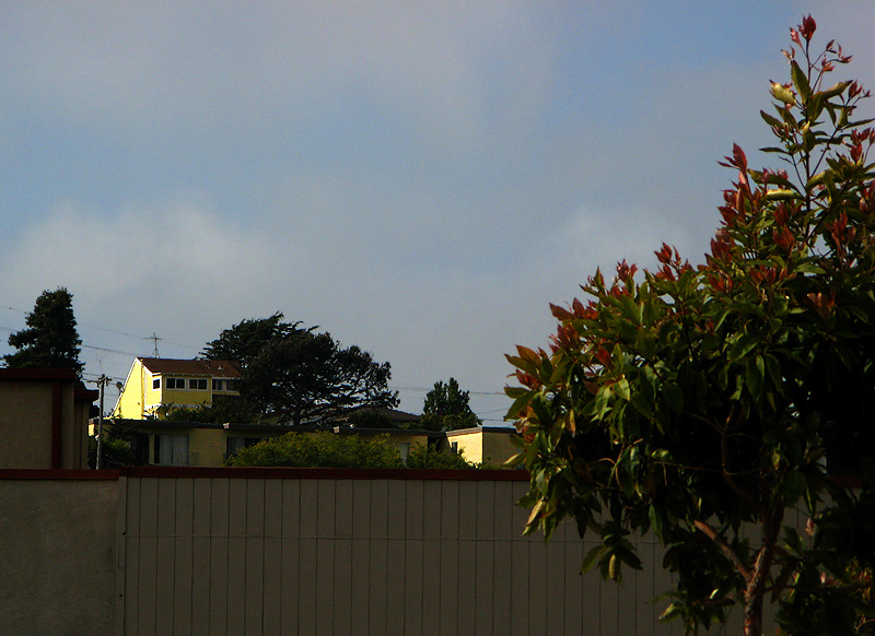 Just houses across the way seen as the sun finally broke