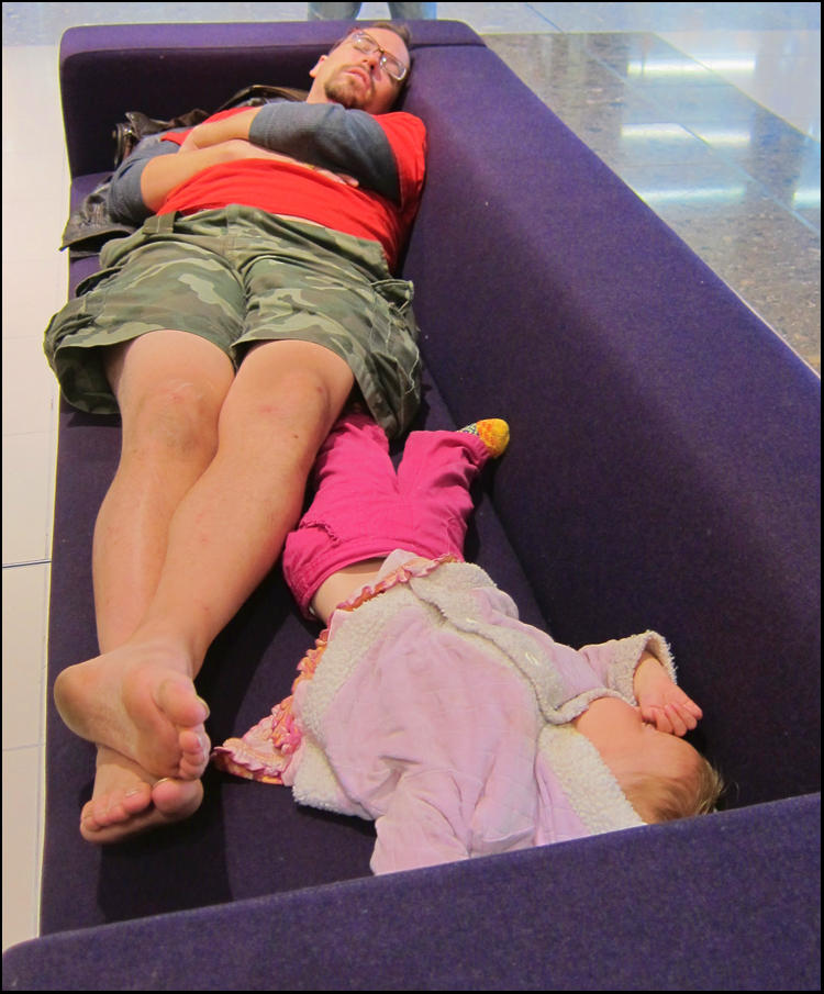 Father and Child asleep at the Mall