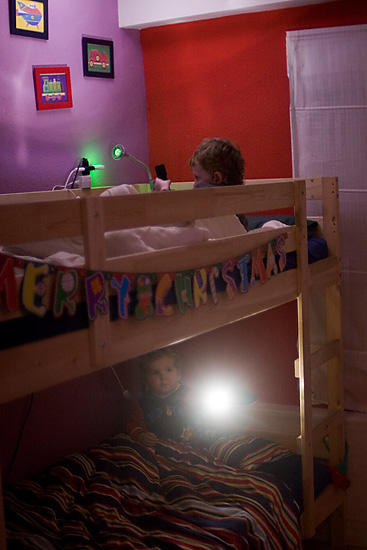December 25 - Luis and S2 in Bed With Christmas Torches