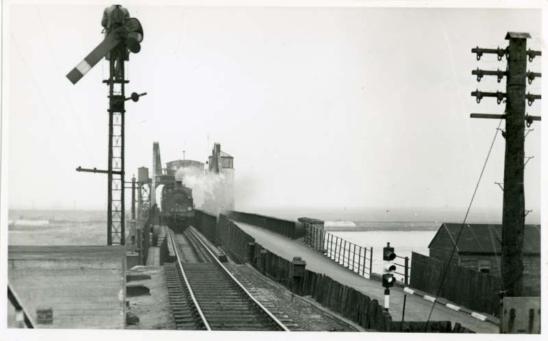 Train over old bridge
