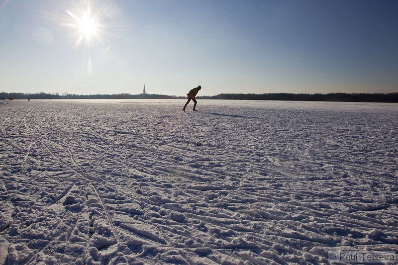 Ice skating on a Dutch frozen lake