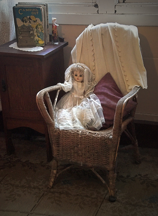 Doll on chair