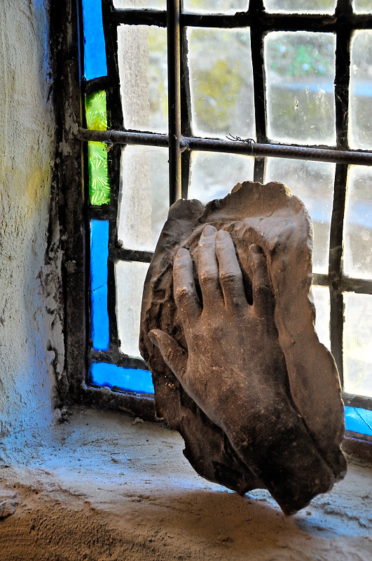Hand by the window