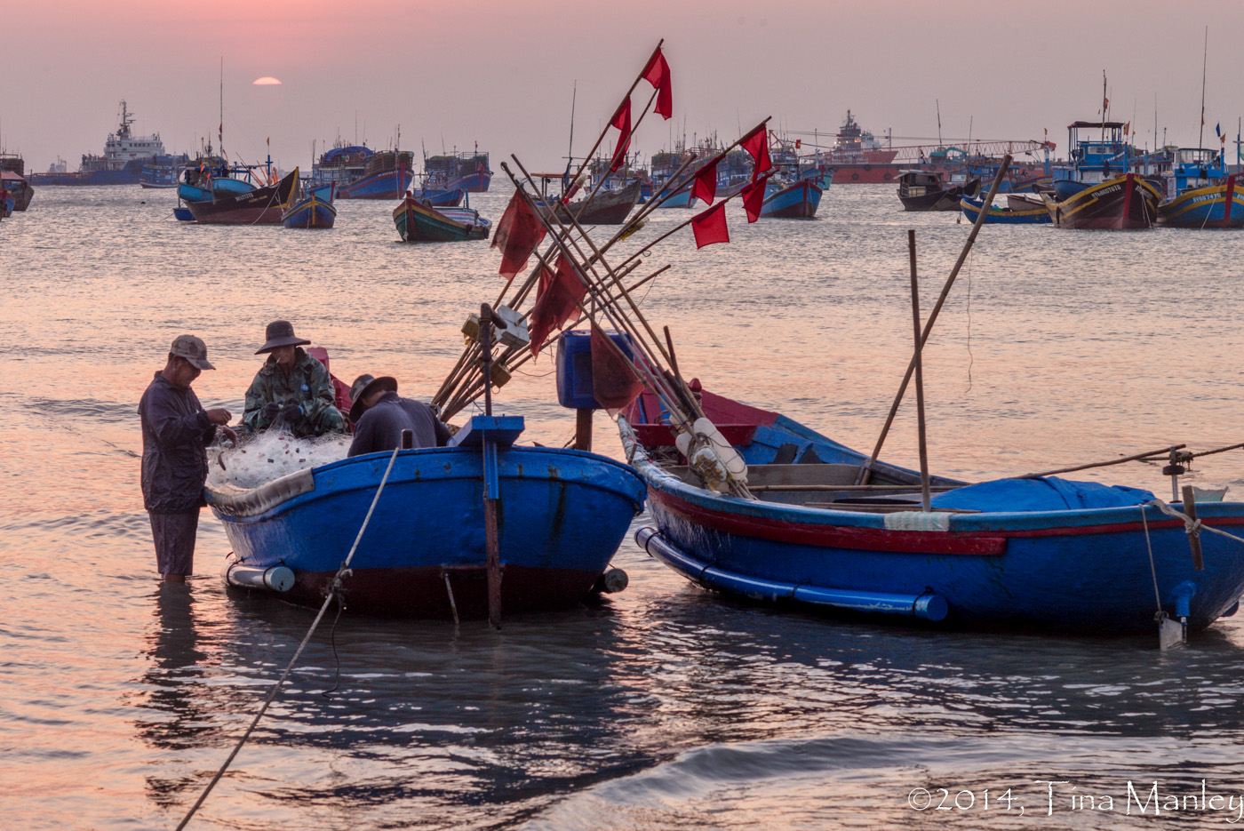 Mending Nets at Sunset
