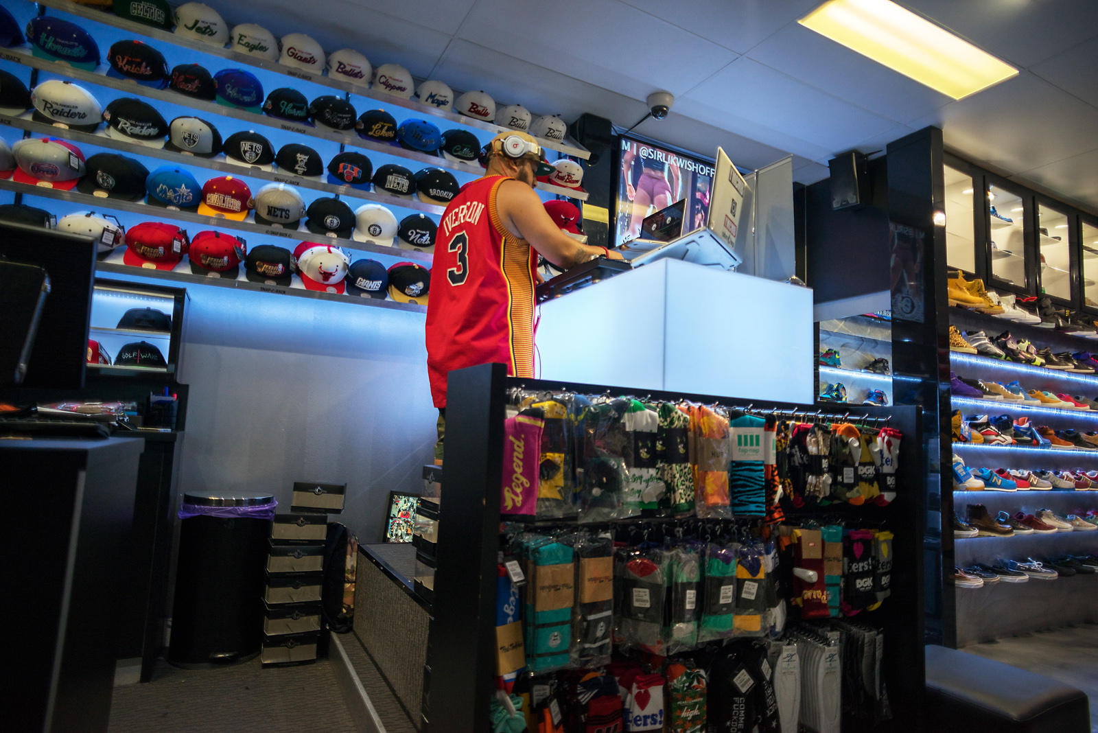 DJ in a sports shop at Queen Street Mall.