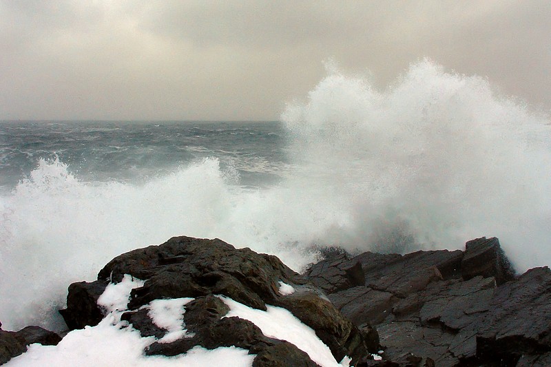 Surf crashing on the rocks behind the Pouch Cove Town Hall