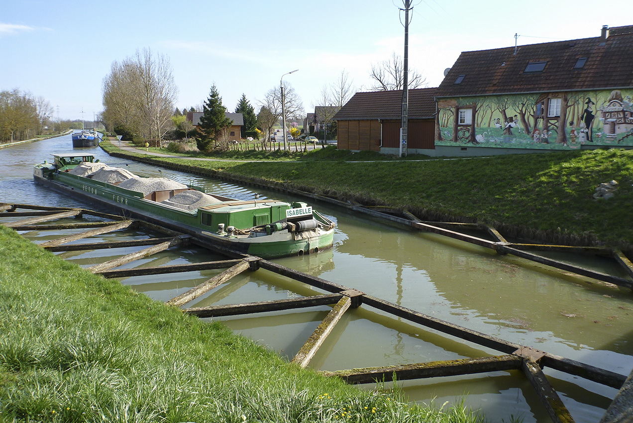 A cement-works barge approaching the lock at Waltenheim