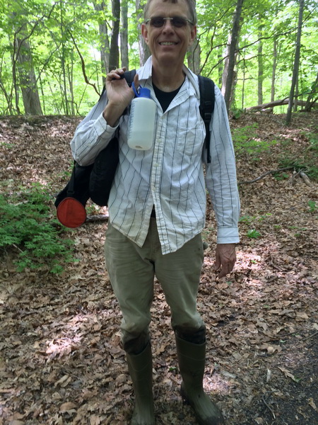 Tom heading into the fen to photograph Cypripedium parviflorum var. makasin