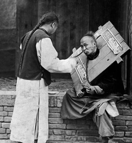 1902 - Feeding a prisoner in a cangue