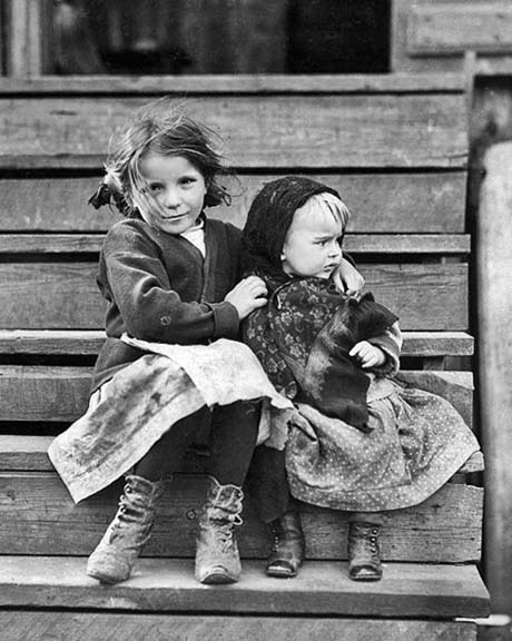 February 1911 - Little Julia tending the baby at home