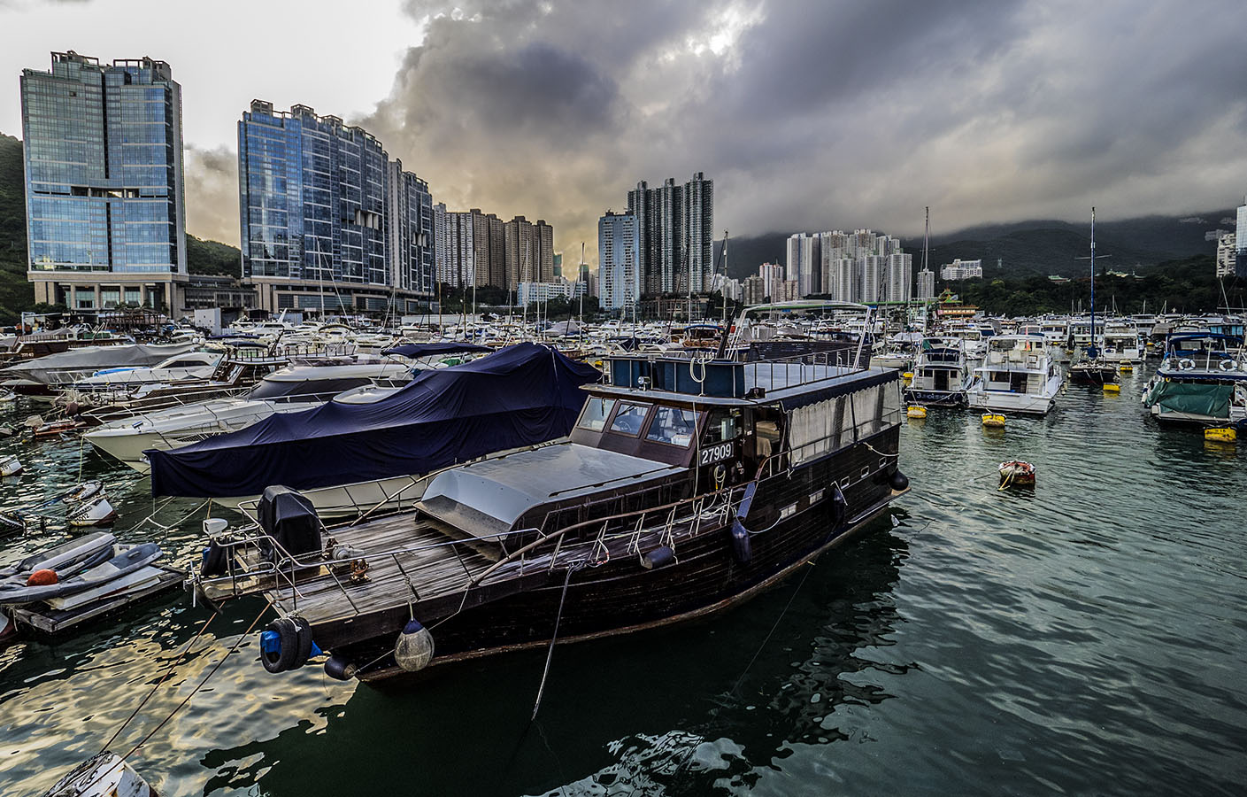 Sunset as the rain clouds clear. Aberdeen Typhoon Shelter, Hong Kong