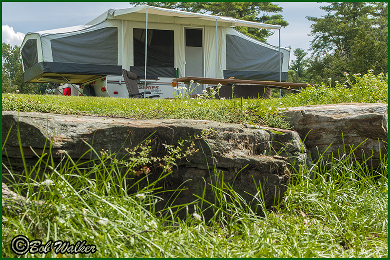 A Popup Camper Looking Up From The Shore