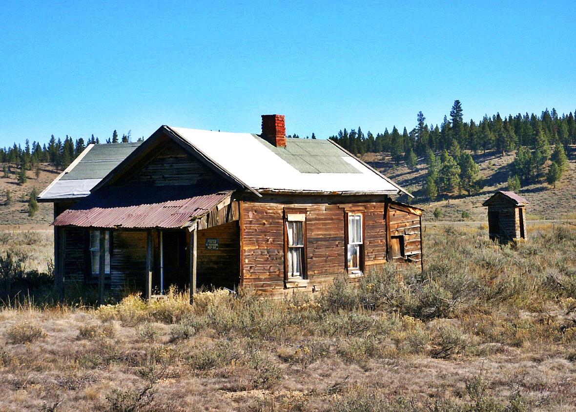 Whitney Ghost Town home and outhouse.JPG