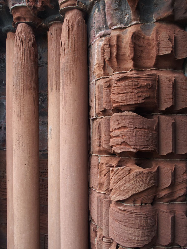 Eroded stone beside cathedral doorway