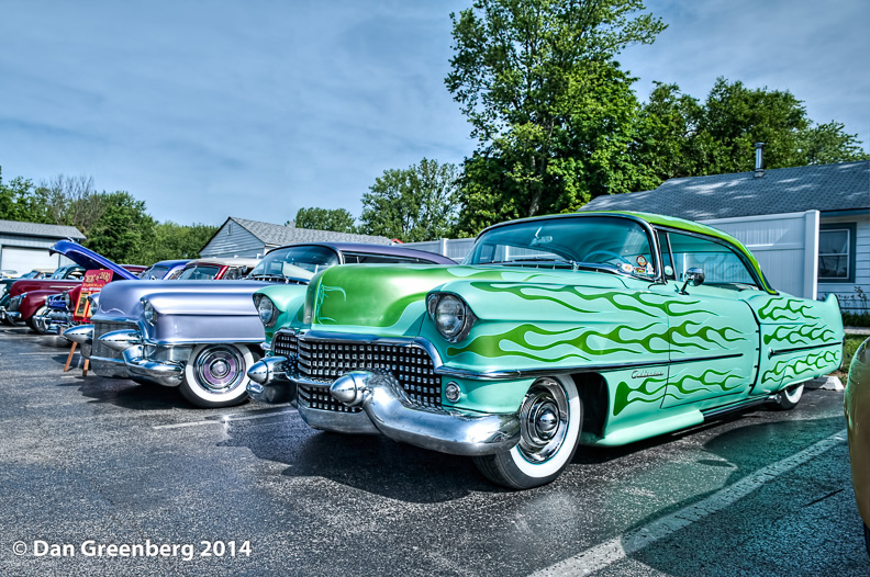 1955 (lavender) and 1954 (green ) Cadillacs