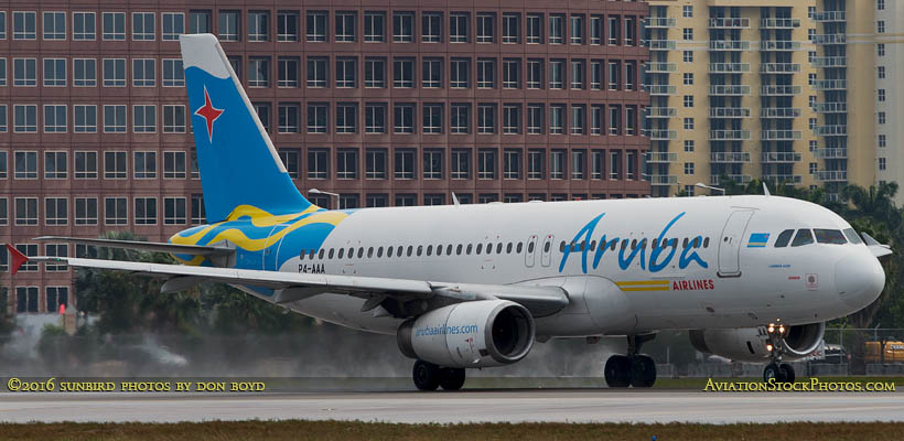 Aruba Airlines Airbus A-320 P4-AAA on takeoff roll on runway 27 at MIA aviation airline stock photo