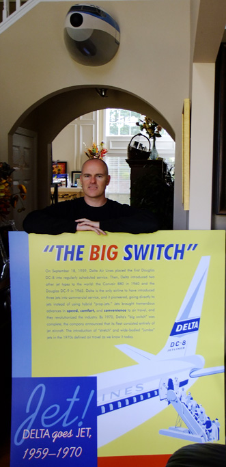October 2013 - Joe Pries with his newly acquired Delta Air Lines poster detailing their transition to an all-jet fleet