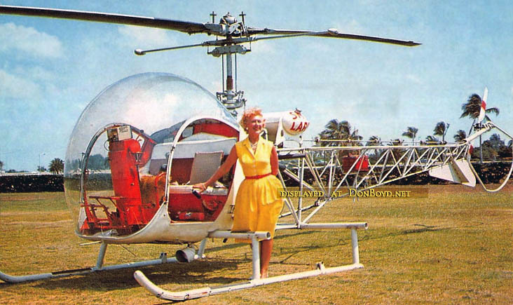 1950s - Ellen M. Gilmore, owner and pilot, posing with a Sky Lark Bell 47 helicopter at Watson Island