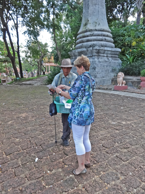 Janet talking to a Cambodian near the Wat Phnom Temple - Phnom Penh, Cambodia