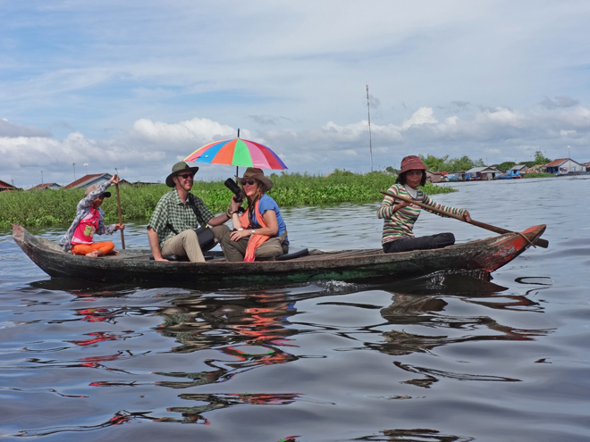 Fran and Alan in a sampan exploring more of the floating village on Tonle Sap Lake, Siem Reap Province, Cambodia