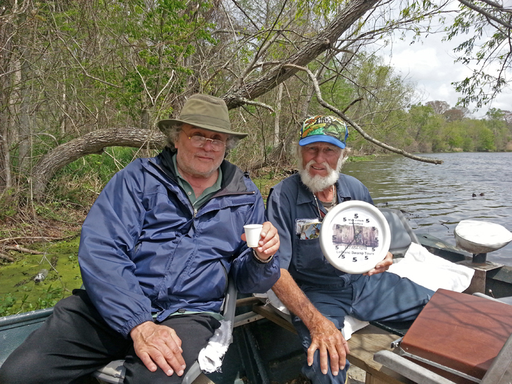 Norbert and Richard on Lake Martin. Norberts clock shows only the number five meaning its time to imbibe anytime.