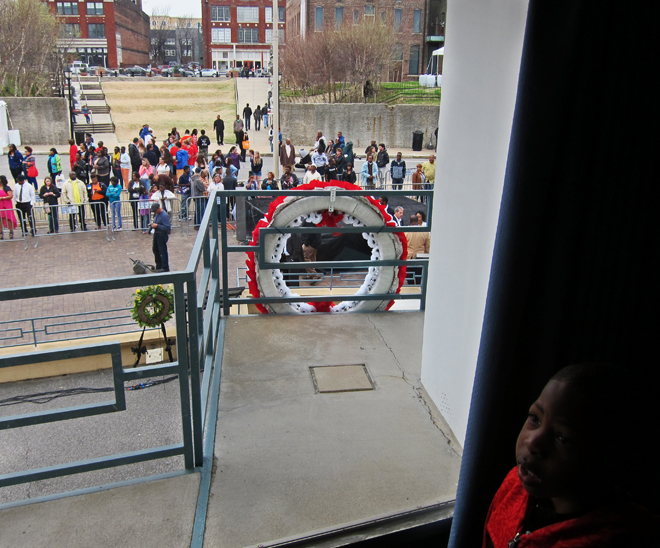 Wreath where Martin Luther King Jr. was assassinated - seen from inside the Lorraine Motel (youngster in lower right) - Memphis