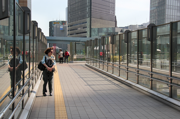 Judy windblown on the middle level walkway next to the Park Hotel
